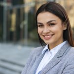 smiley-businesswoman-posing-outdoors (1)